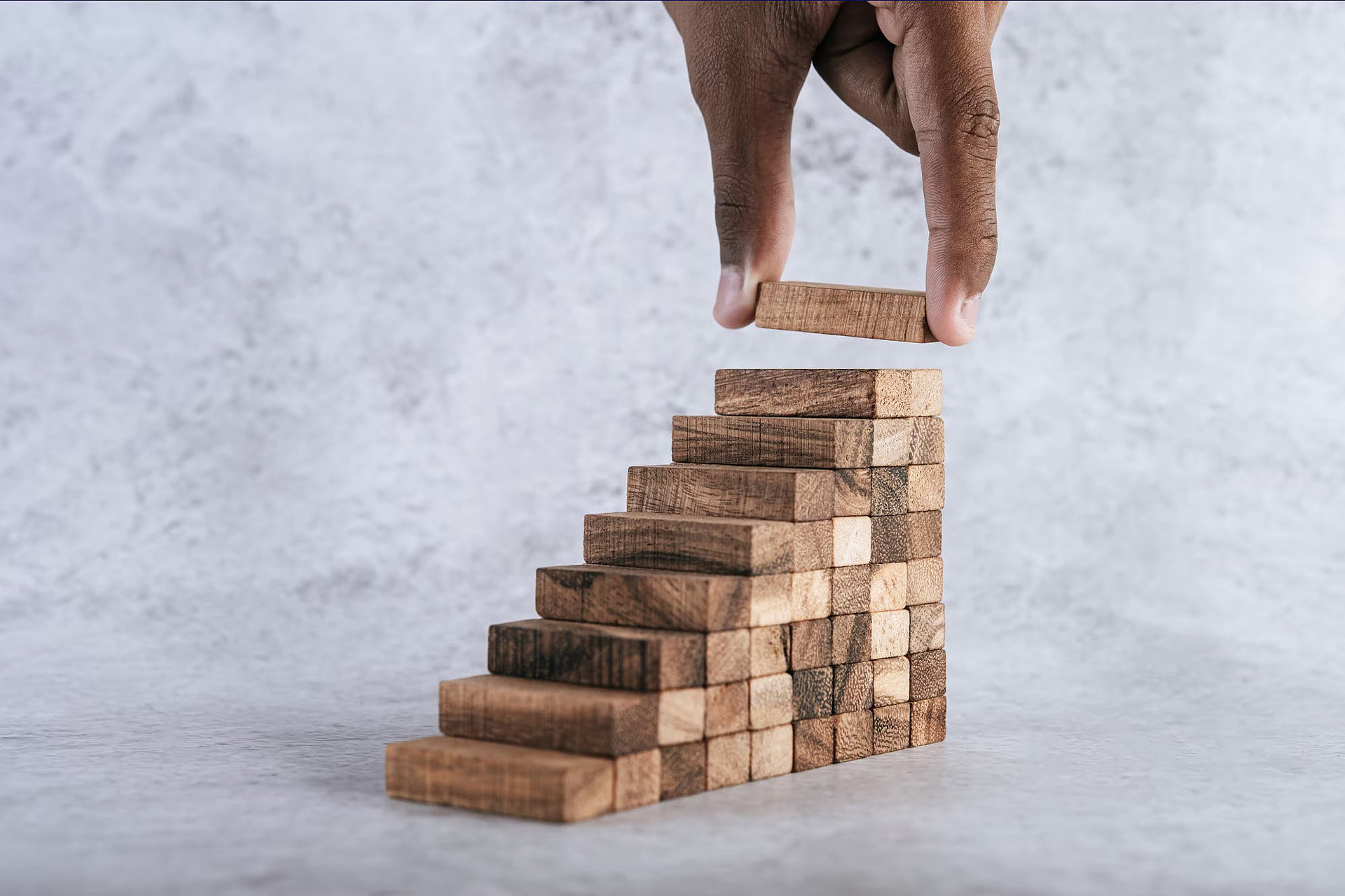 Staircase to success made of wooden blocks